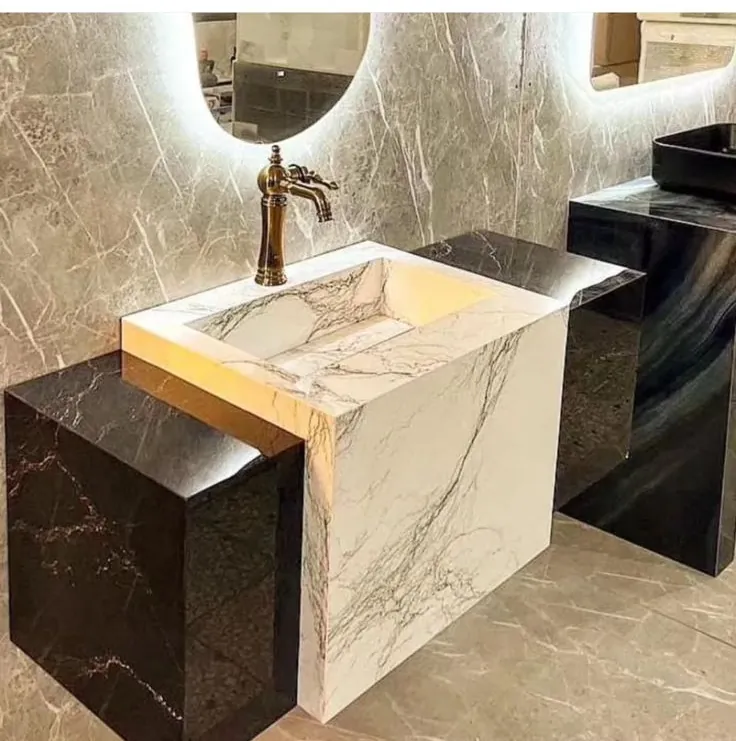 Lavatório em mármore branco com cuba esculpida na pedra